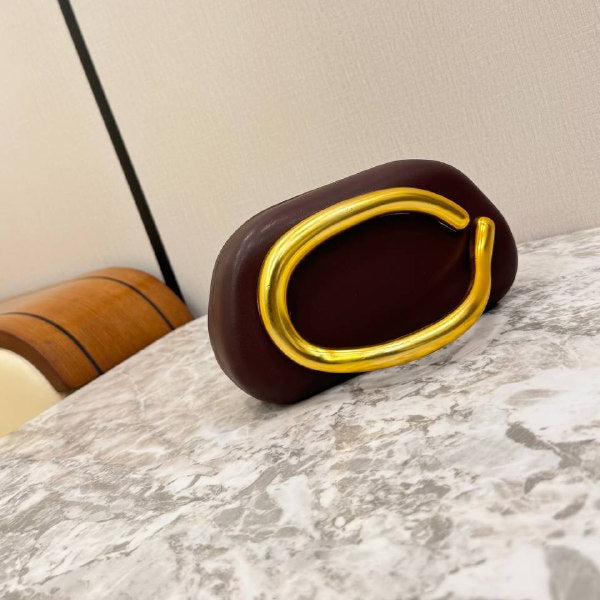 Snakeskin Print Oval Clutch with Sculptural Gold Handle 🐍✨👜