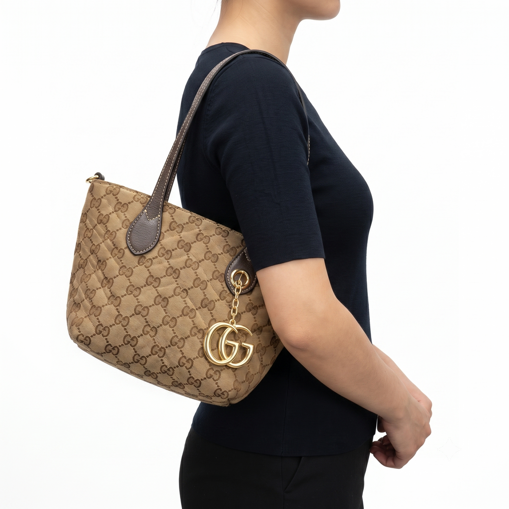 Gucci GG Monogram Tote Bag with Gold-Tone Charm 👜✨