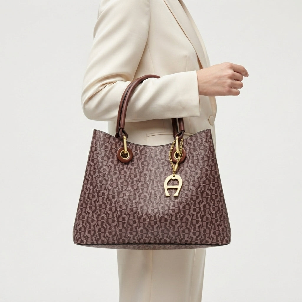Aigner Monogram Handbag with Gold Tone Hardware