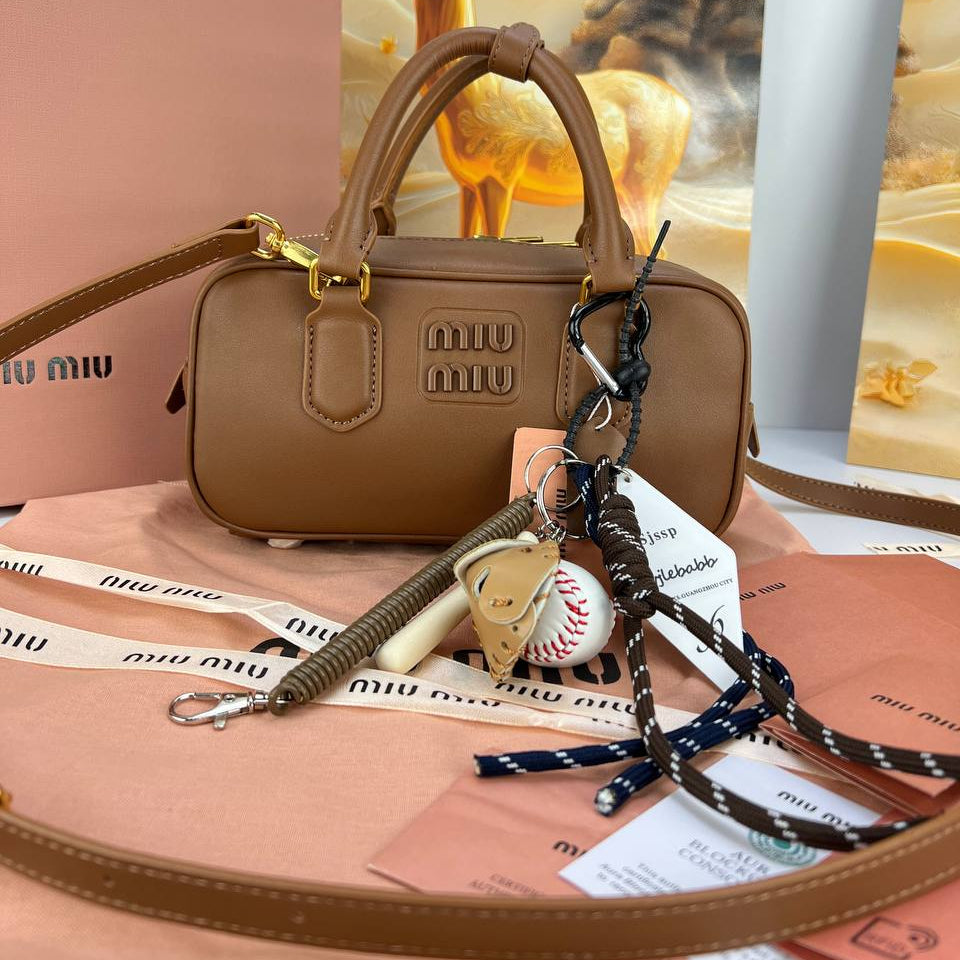 Miu Miu Signature Brown Leather Handbag with Playful Charms 👜✨