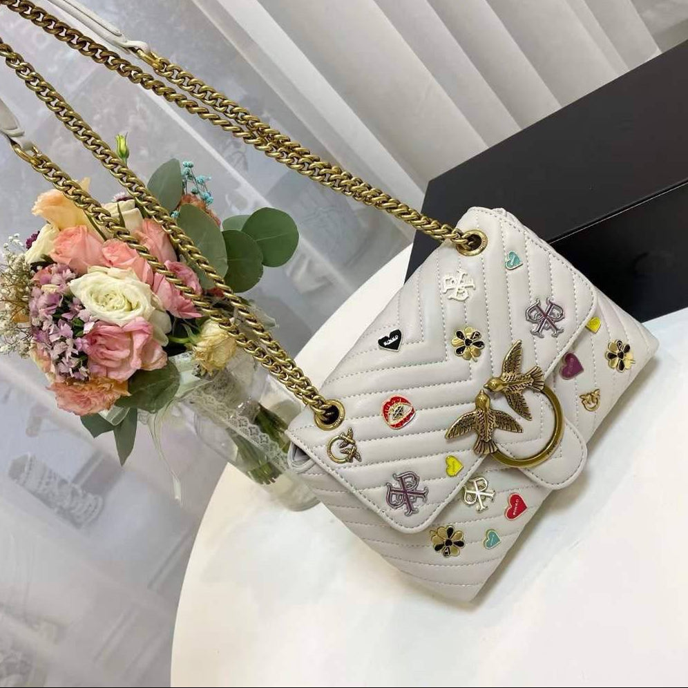 Pinko Quilted Crossbody Bag with Playful Pin Embellishments 🕊️✨