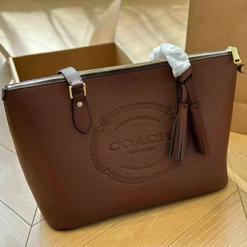 Coach Signature Embossed PVC City Tote with Tassel Detail