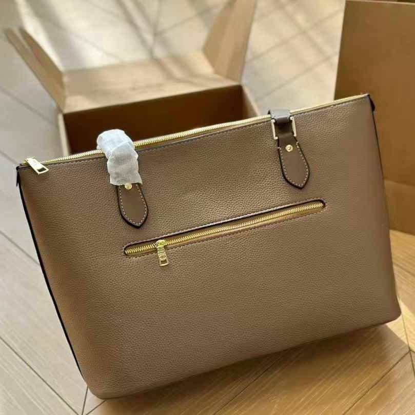 Coach Signature Embossed PVC City Tote with Tassel Detail