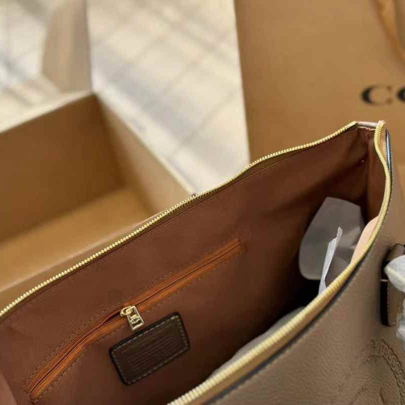 Coach Signature Embossed PVC City Tote with Tassel Detail