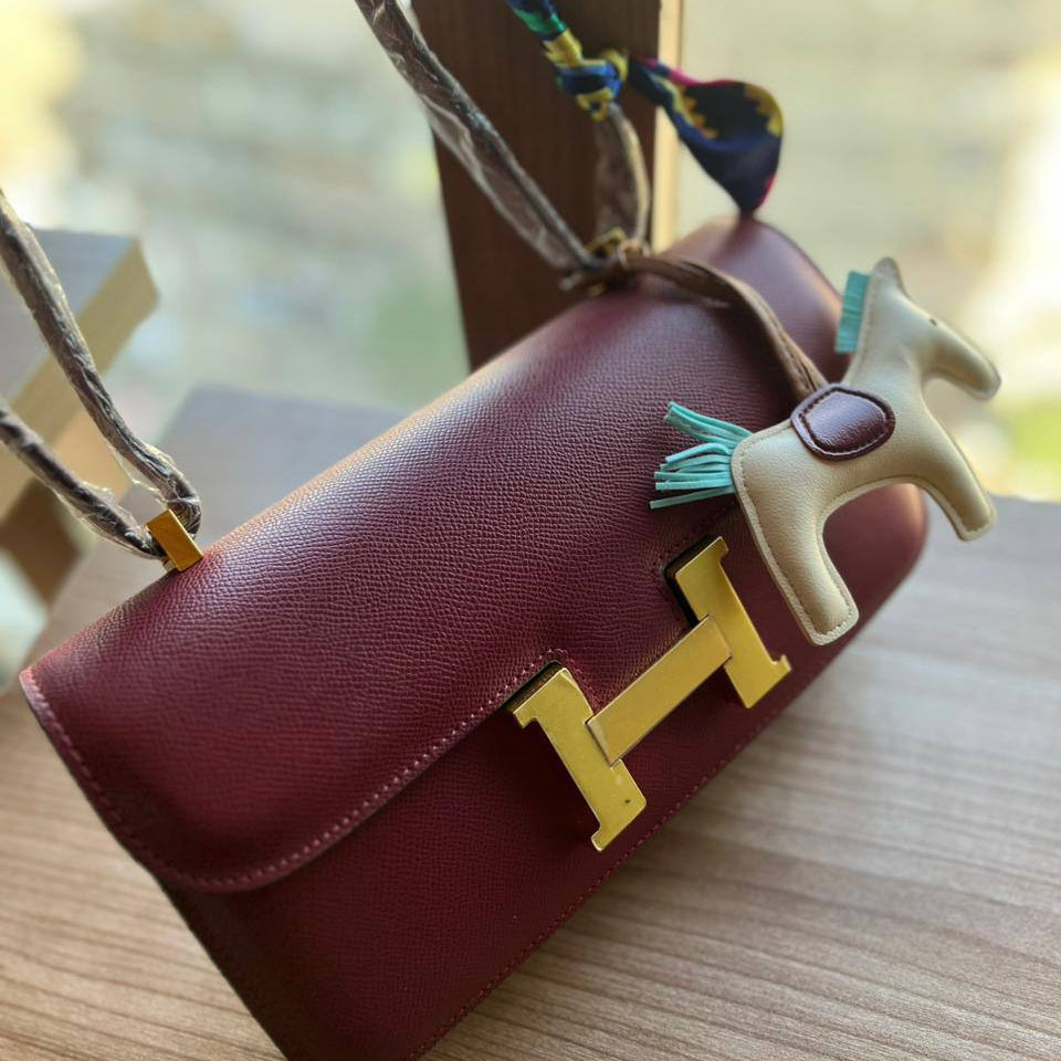 Elegant H-Clasp Shoulder Bag with Scarf Handle and Horse Charm