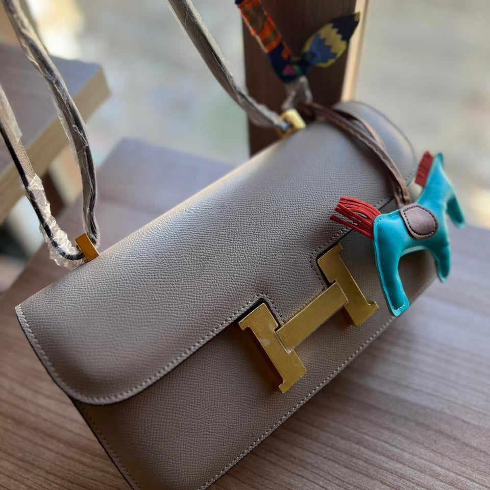 Elegant H-Clasp Shoulder Bag with Scarf Handle and Horse Charm