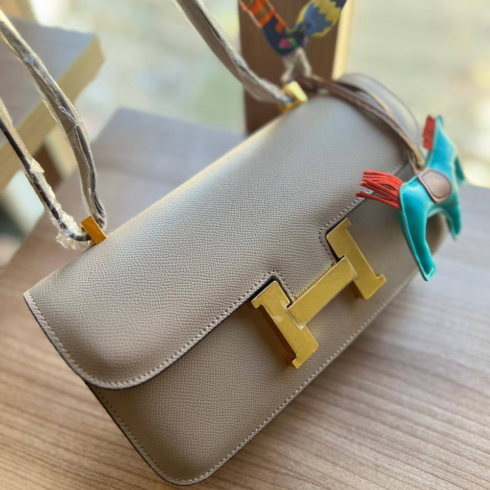 Elegant H-Clasp Shoulder Bag with Scarf Handle and Horse Charm