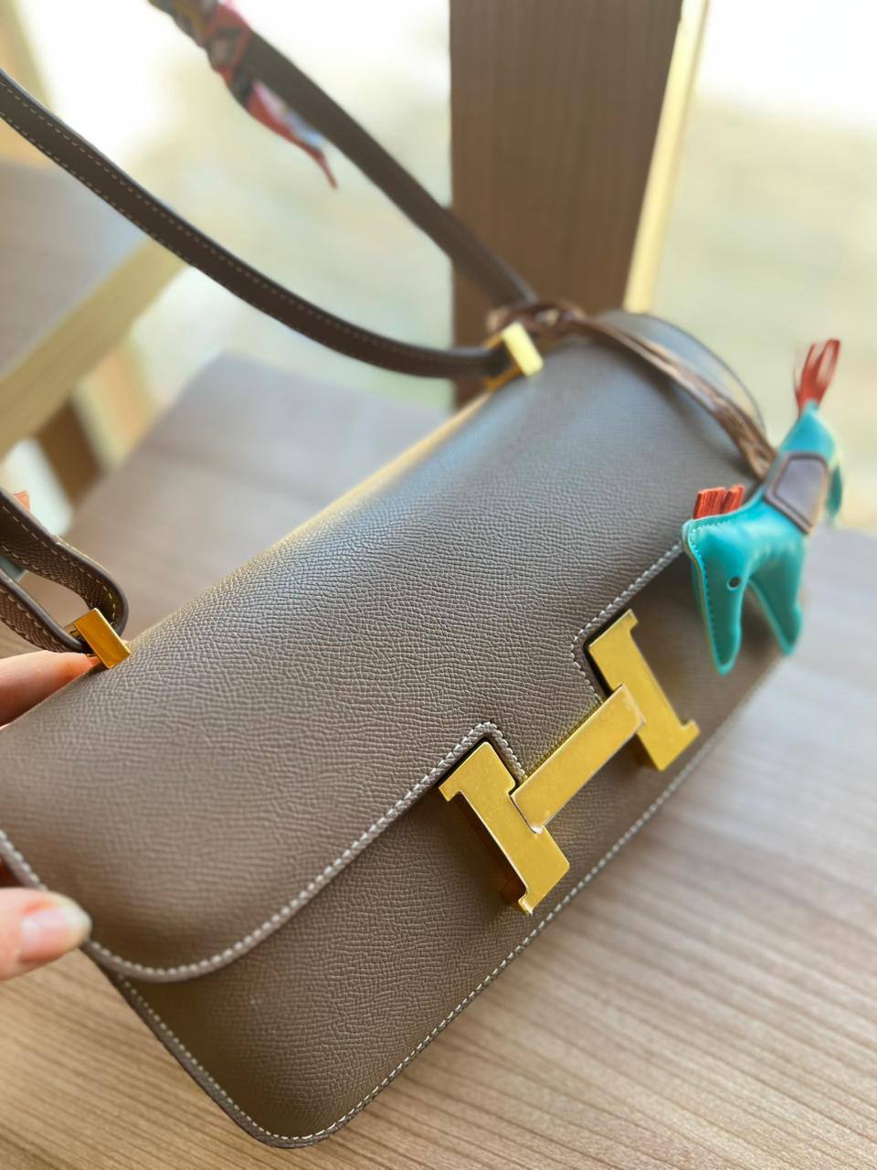 Elegant H-Clasp Shoulder Bag with Scarf Handle and Horse Charm