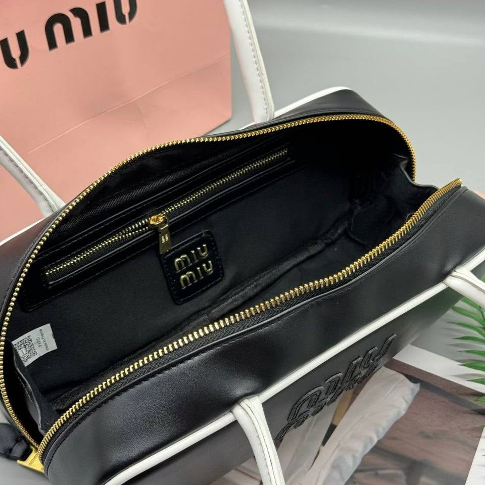 Miu Miu Leather Cylinder Bowling Bag with Contrast Piping 👜🍫✨