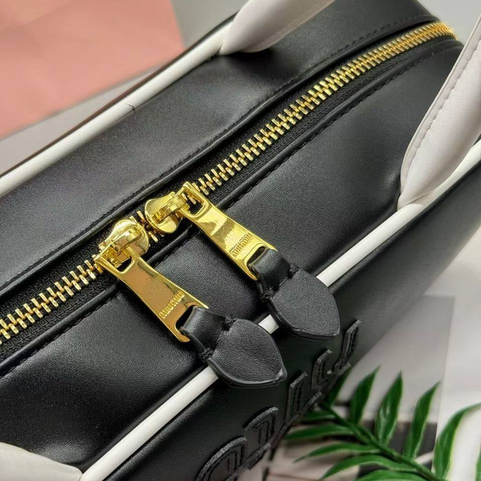 Miu Miu Leather Cylinder Bowling Bag with Contrast Piping 👜🍫✨