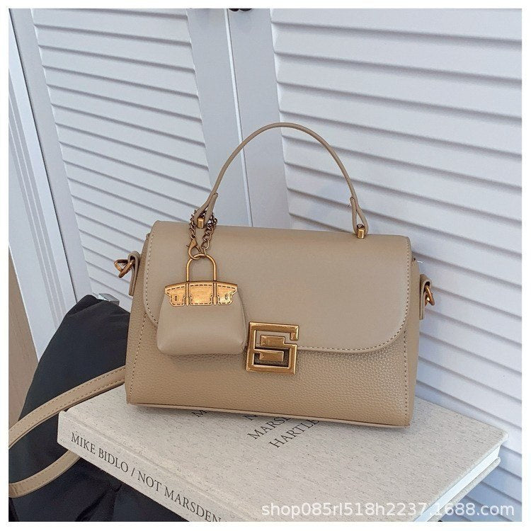 Structured Crossbody Bag with Elegant Gold S Logo Clasp