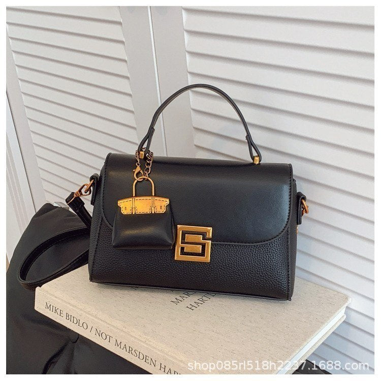 Structured Crossbody Bag with Elegant Gold S Logo Clasp