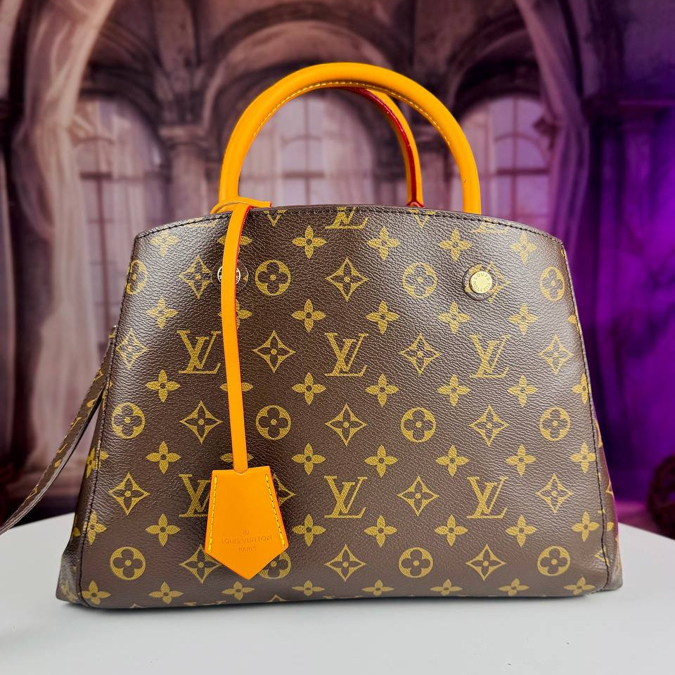 Louis Vuitton Monogram Handbag with Vibrant Orange Accents