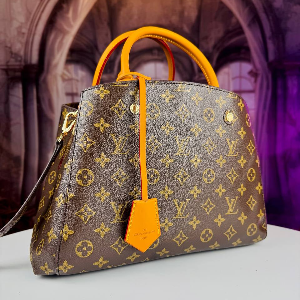 Louis Vuitton Monogram Handbag with Vibrant Orange Accents
