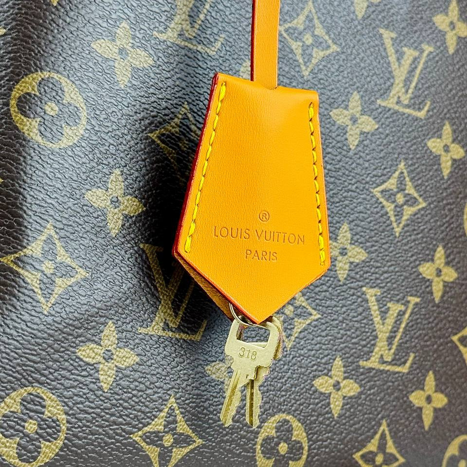 Louis Vuitton Monogram Handbag with Vibrant Orange Accents