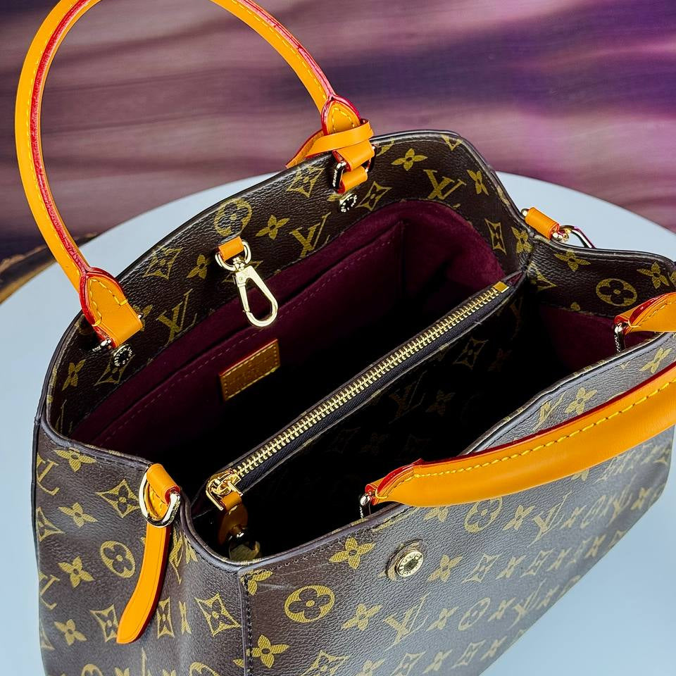 Louis Vuitton Monogram Handbag with Vibrant Orange Accents