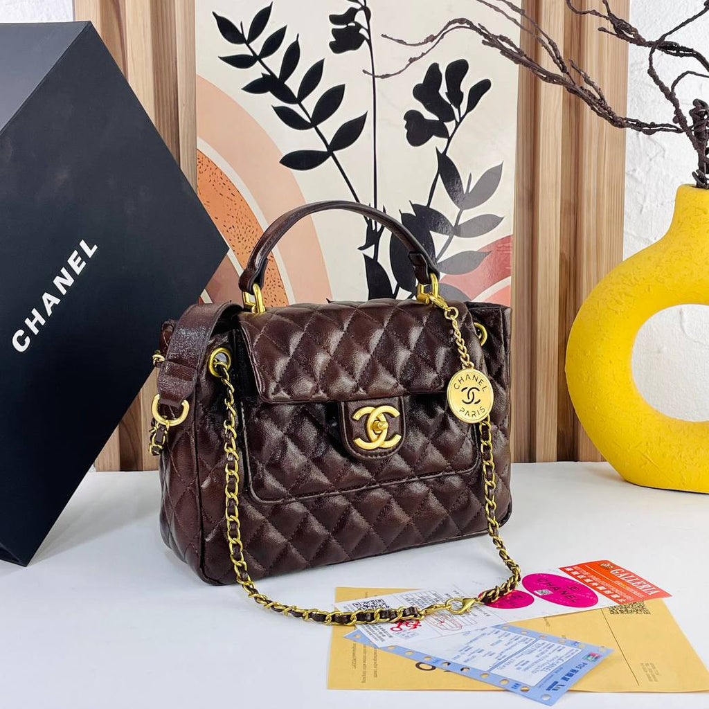 Chanel Burgundy Quilted Handbag with Gold Tone Chain