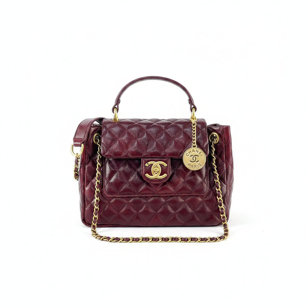 Chanel Burgundy Quilted Handbag with Gold Tone Chain