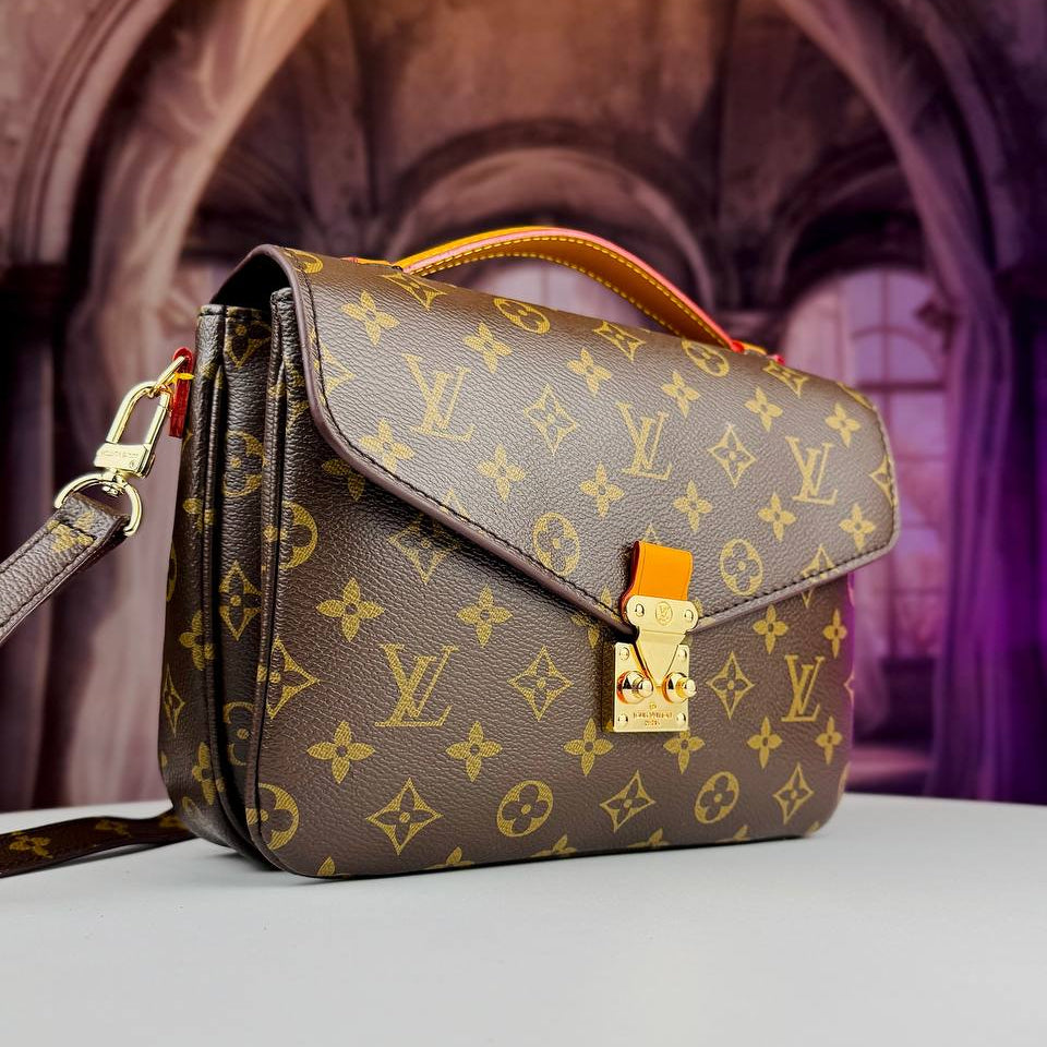 Louis Vuitton Monogram Satchel with Vibrant Orange Accents