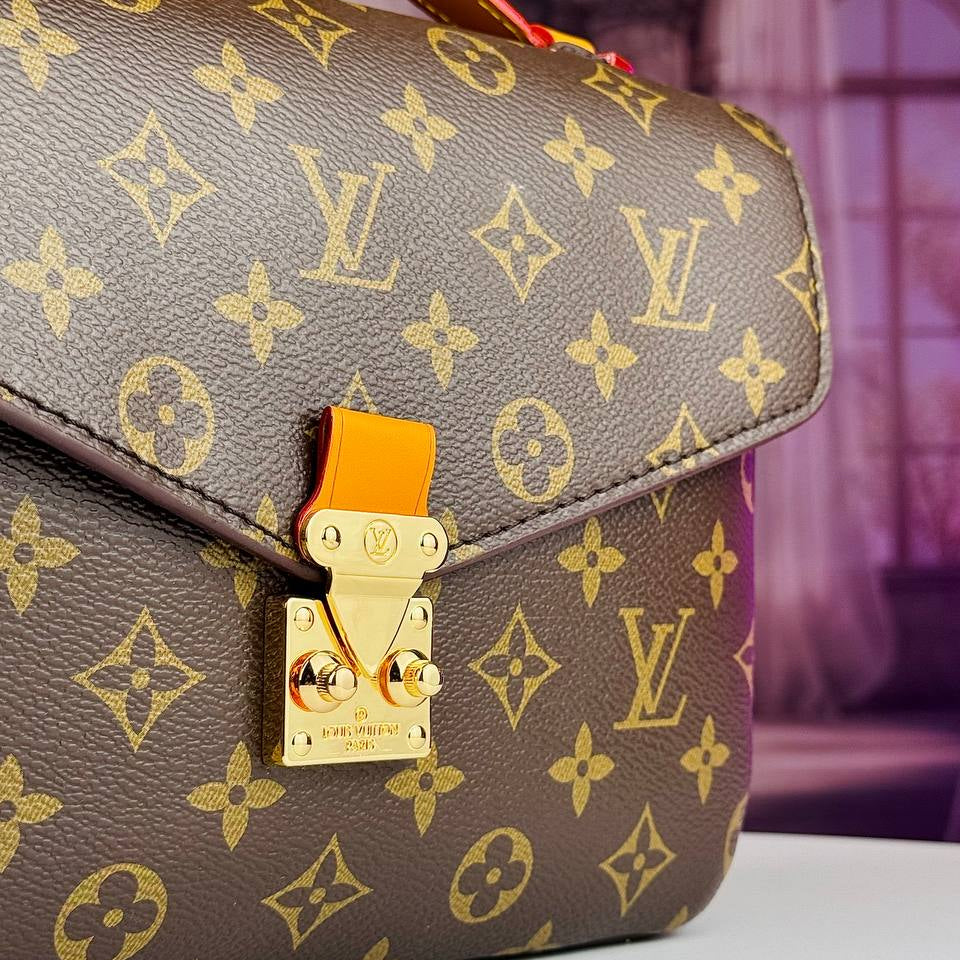Louis Vuitton Monogram Satchel with Vibrant Orange Accents
