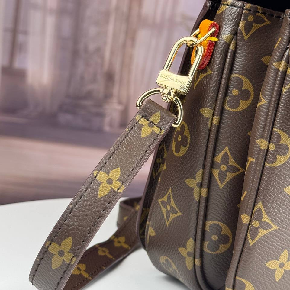 Louis Vuitton Monogram Satchel with Vibrant Orange Accents