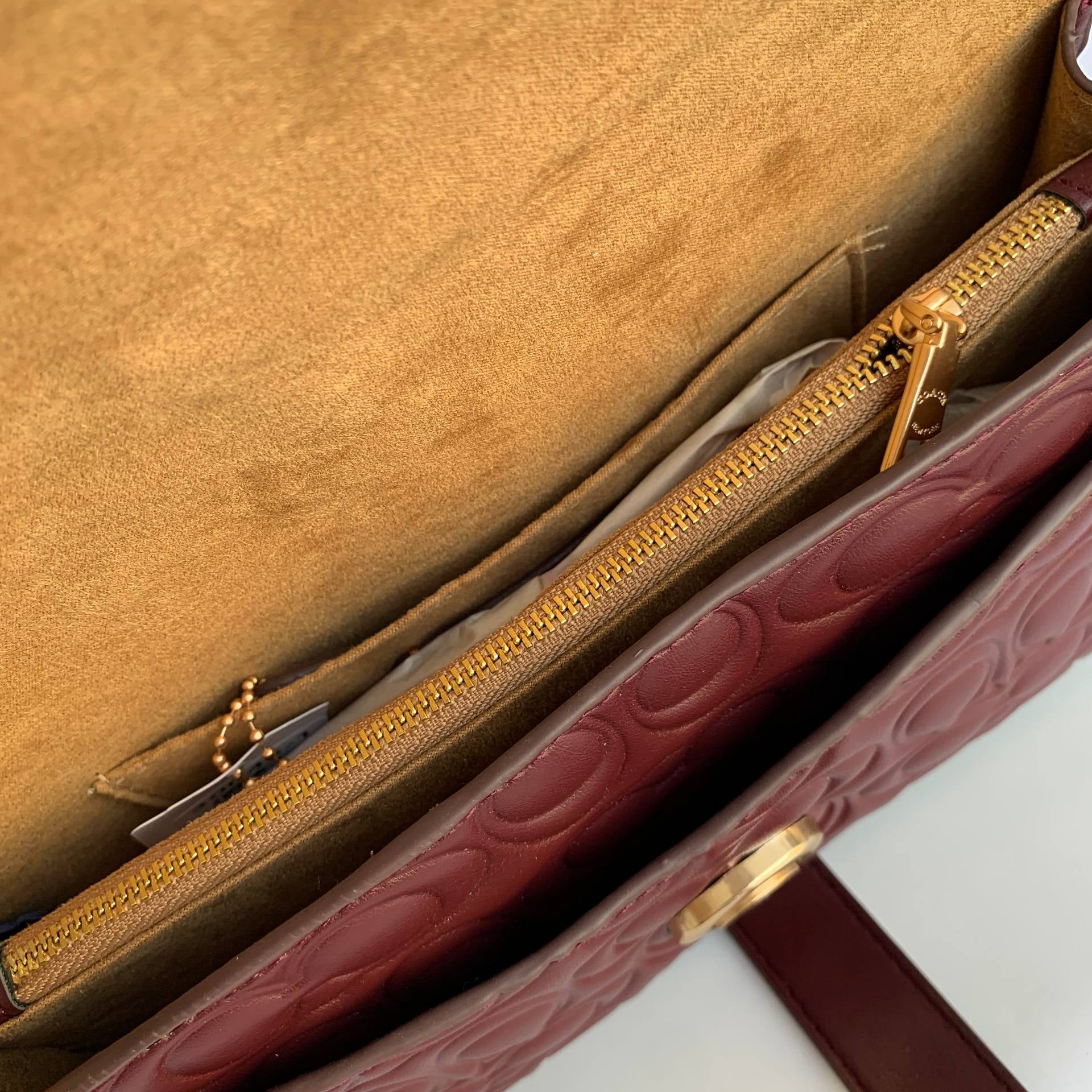 Coach Signature Embossed Leather Shoulder Bag