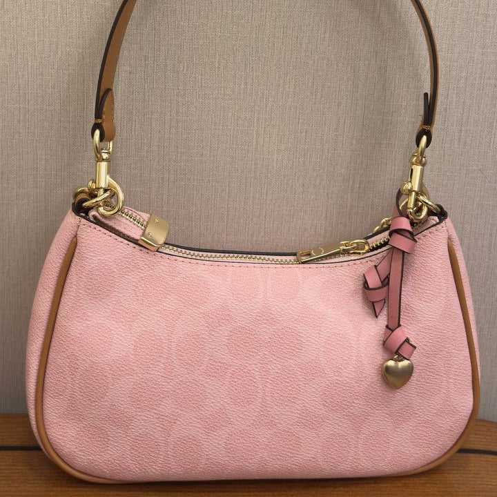 Coach Pink Shoulder Bag with Floral Charm and Gold Hardware 🌸👜