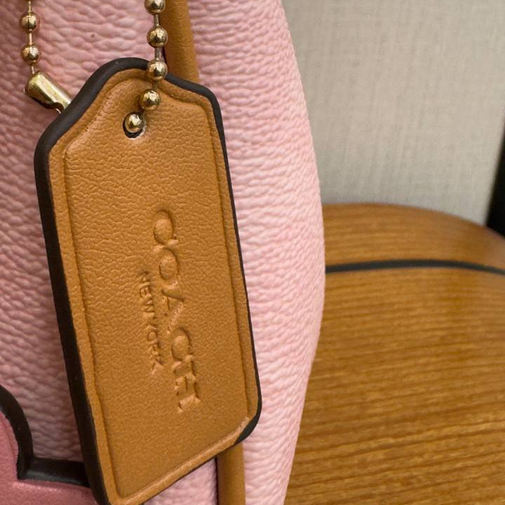 Coach Pink Shoulder Bag with Floral Charm and Gold Hardware 🌸👜