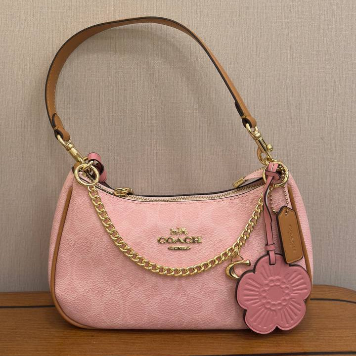 Coach Pink Shoulder Bag with Floral Charm and Gold Hardware 🌸👜