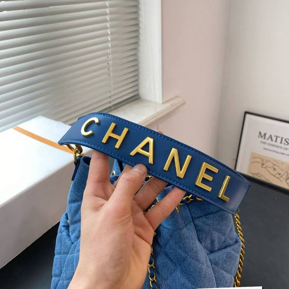 Chanel Quilted Denim Bucket Bag with Gold Chain Detail