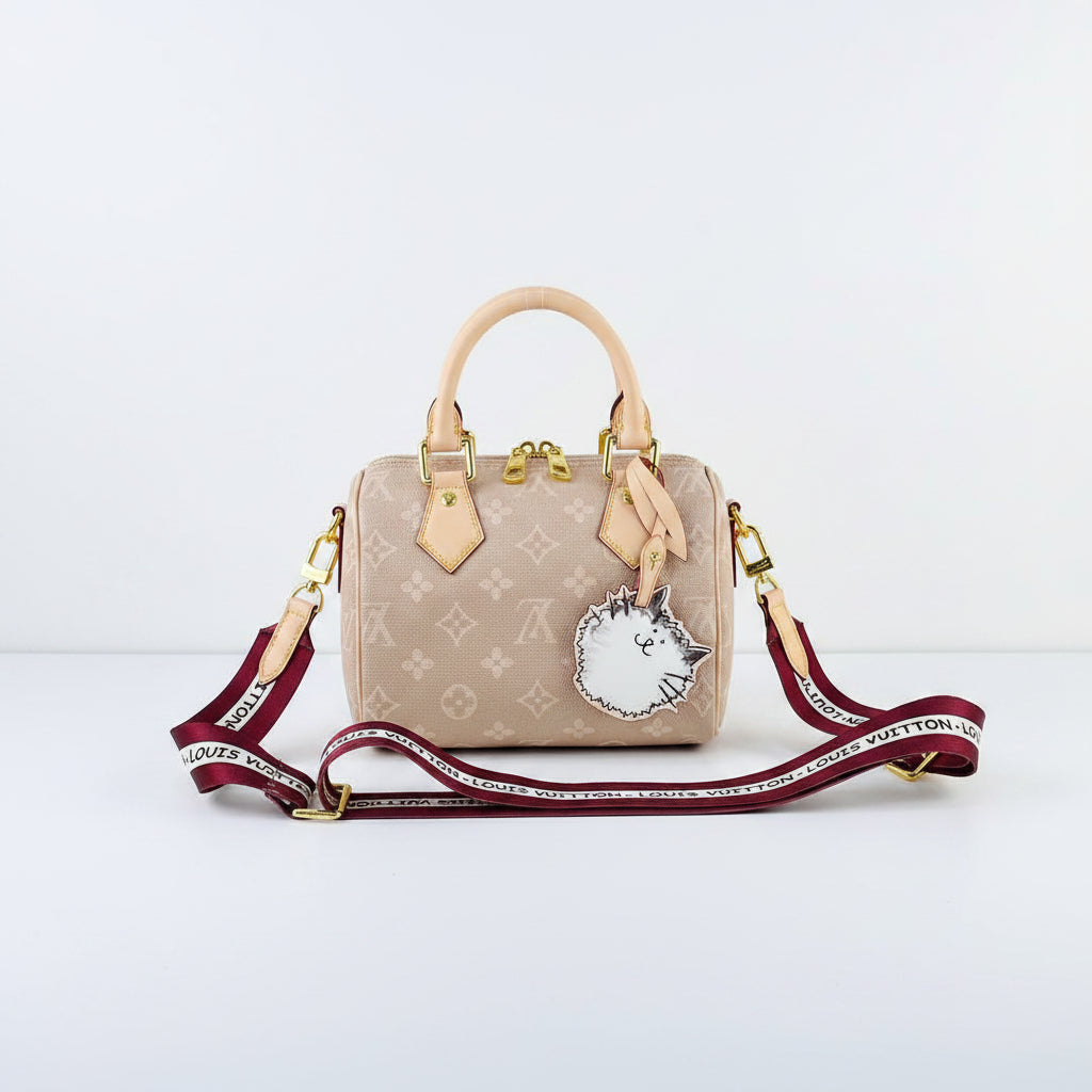 Louis Vuitton Monogram Canvas Bag with Playful Cat Charm 👜🐱
