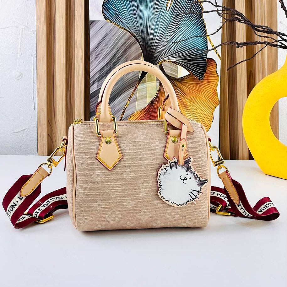 Louis Vuitton Monogram Canvas Bag with Playful Cat Charm 👜🐱