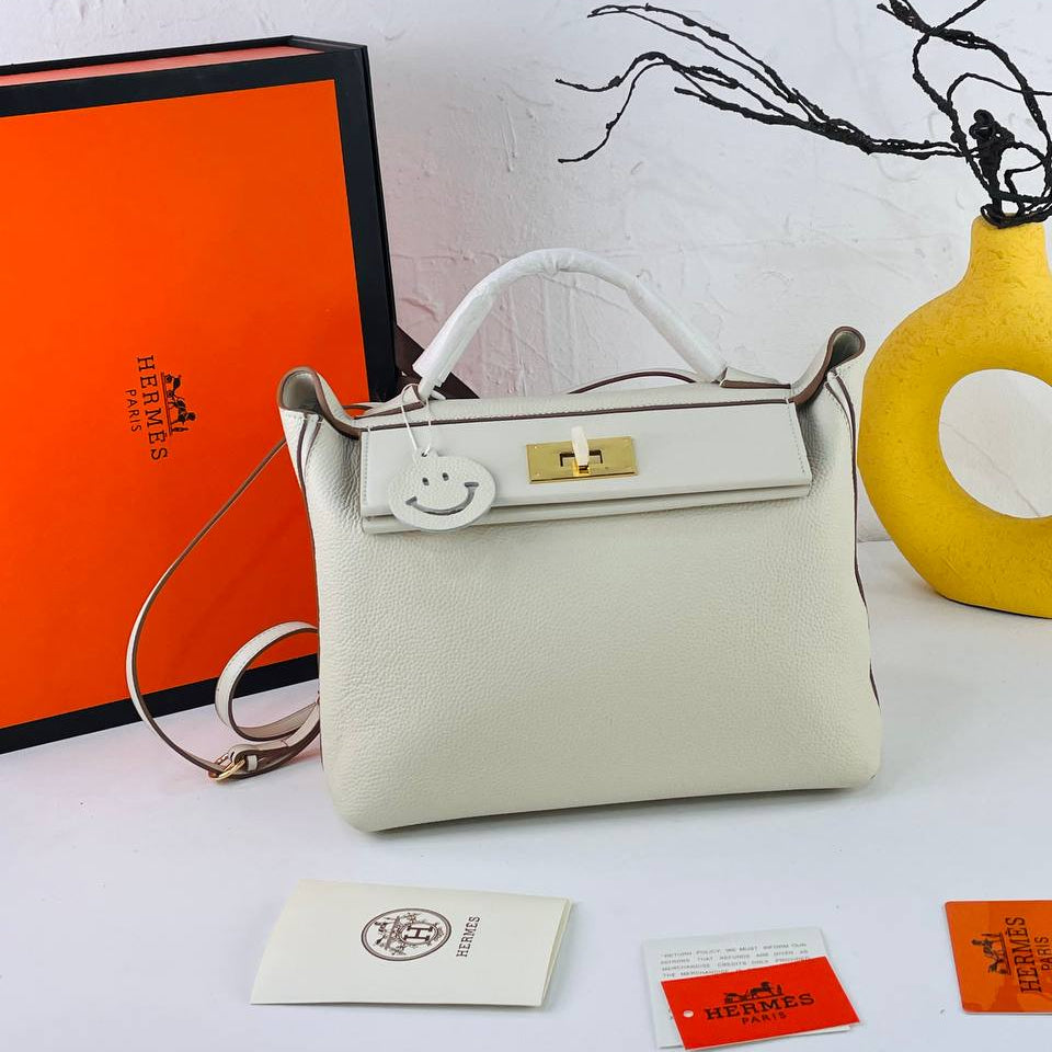 Elegant Off-White Genuine Leather Handbag with Gold Hardware 👜✨