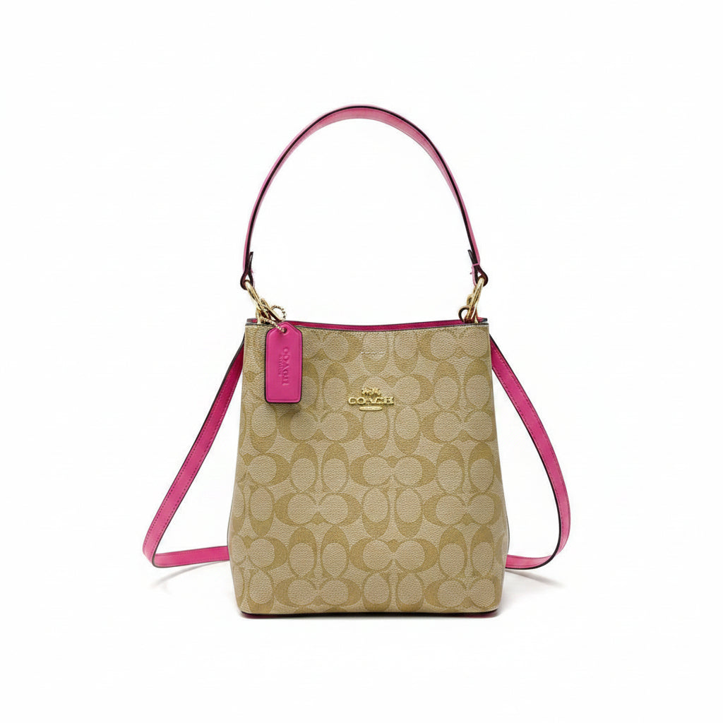 Coach Signature Canvas Bucket Bag with Vibrant Pink Accents