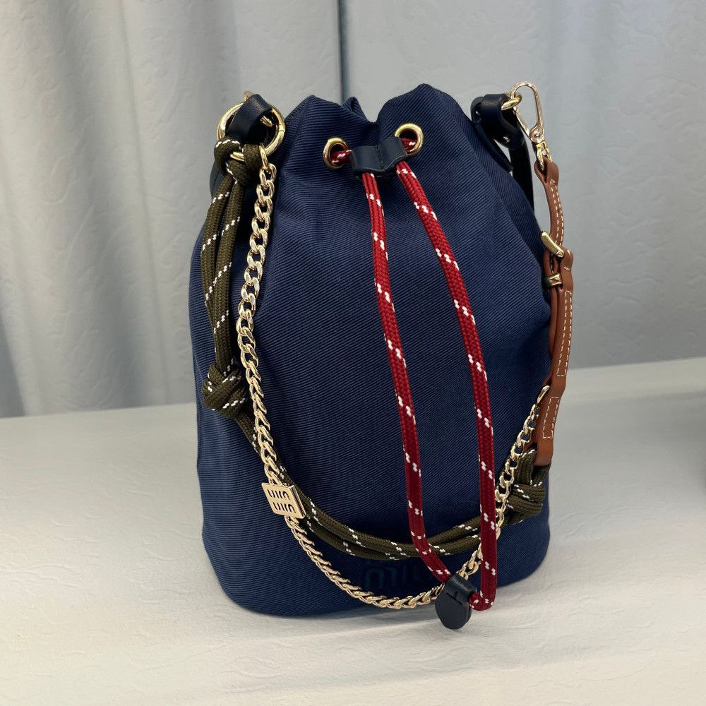 Miu Miu Canvas Drawstring Bucket Bag in Olive Green