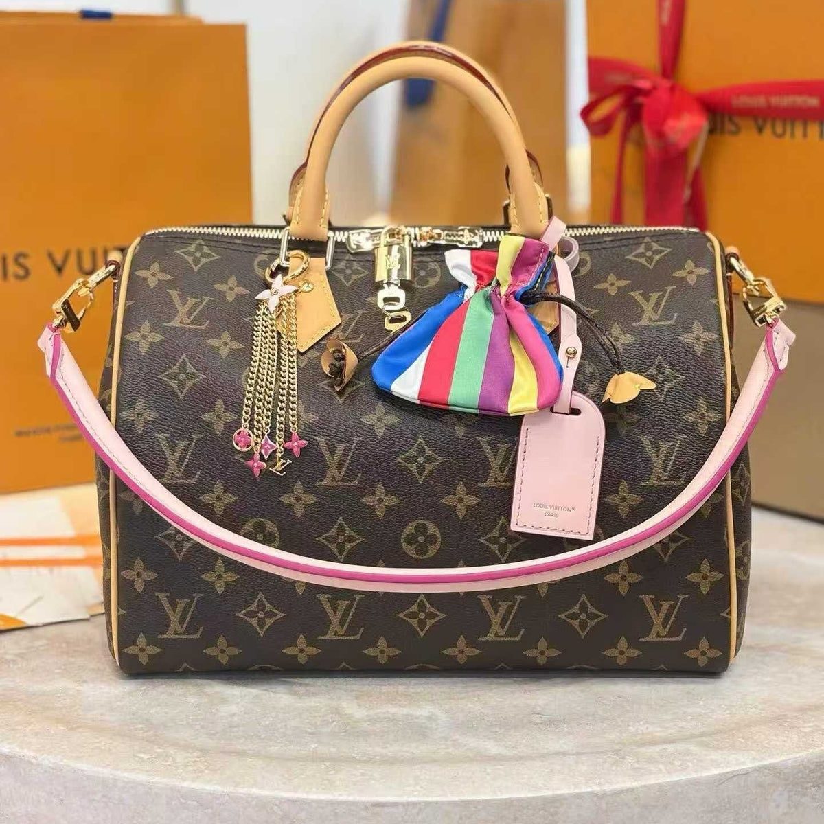 Louis Vuitton Monogram Handbag with Triple Chain Accessory