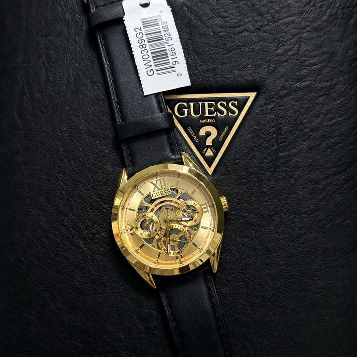 Guess Gold Tone Skeleton Dial Watch with Black Leather Strap