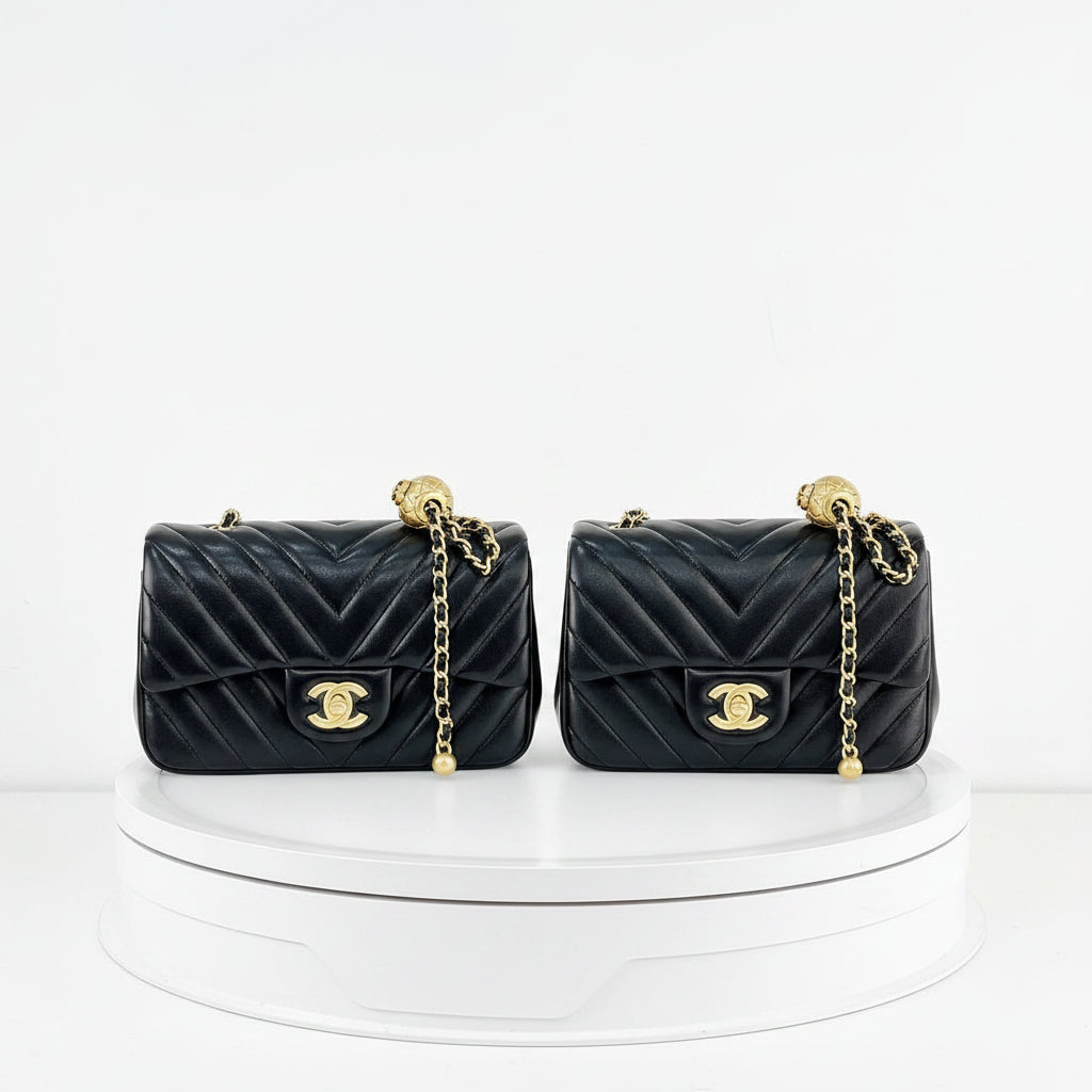 Chanel Black Leather Flap Bag with Signature Gold Ball Detail