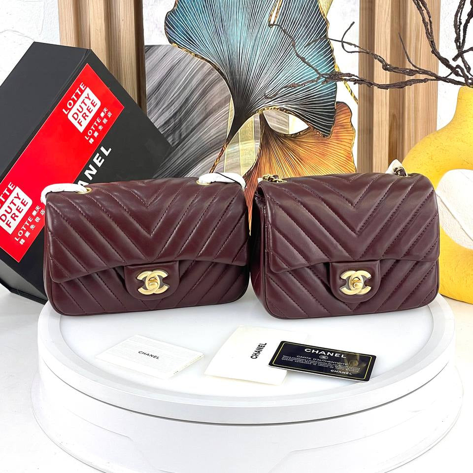 Chanel Black Leather Flap Bag with Signature Gold Ball Detail
