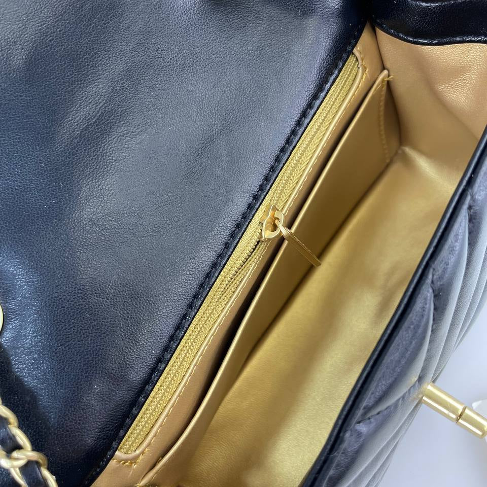 Chanel Black Leather Flap Bag with Signature Gold Ball Detail