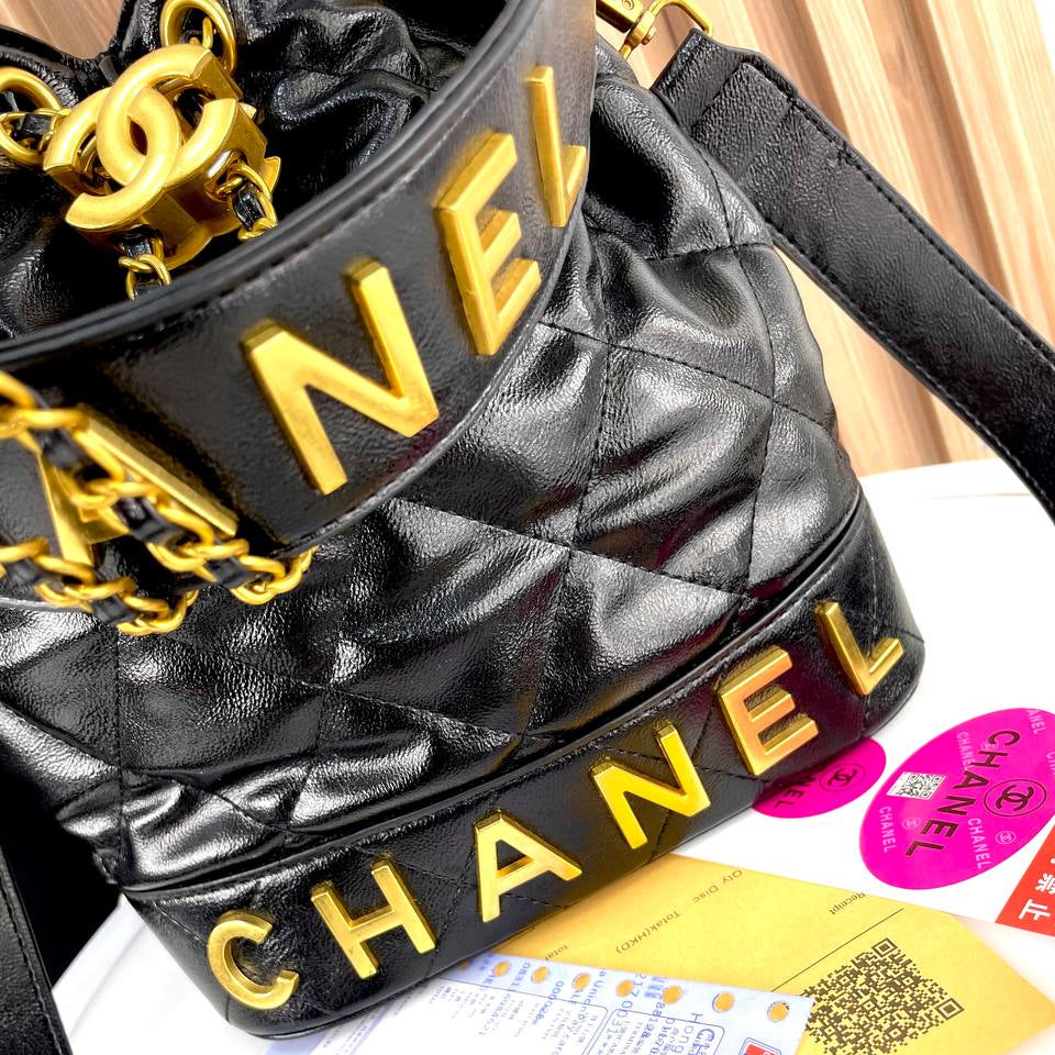 Chanel Quilted White Bucket Bag with Gold Chain Detail