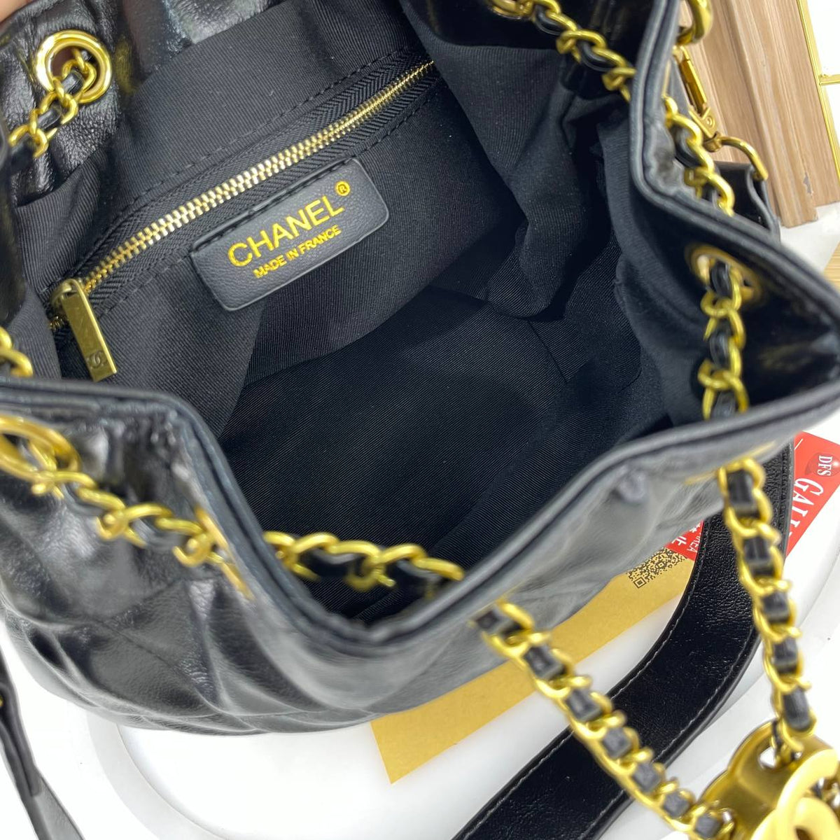 Chanel Quilted White Bucket Bag with Gold Chain Detail