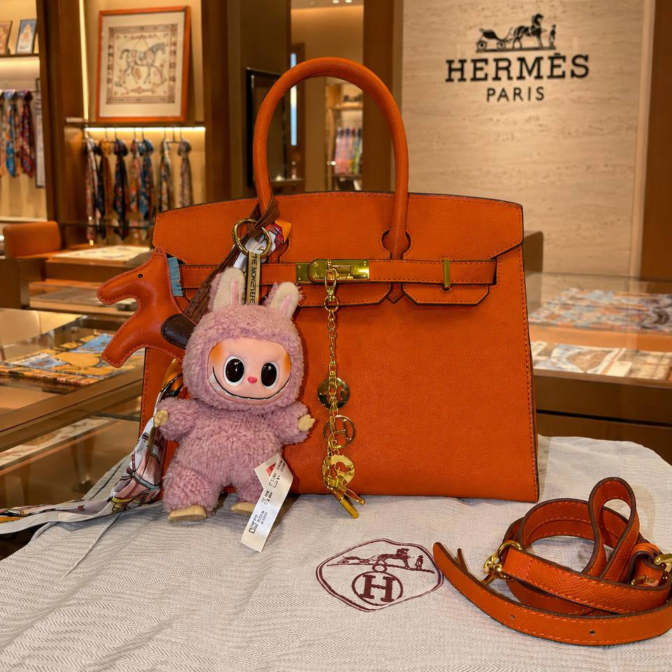 Hermes Style Handbag with Playful Labubu Doll Charm 👜✨