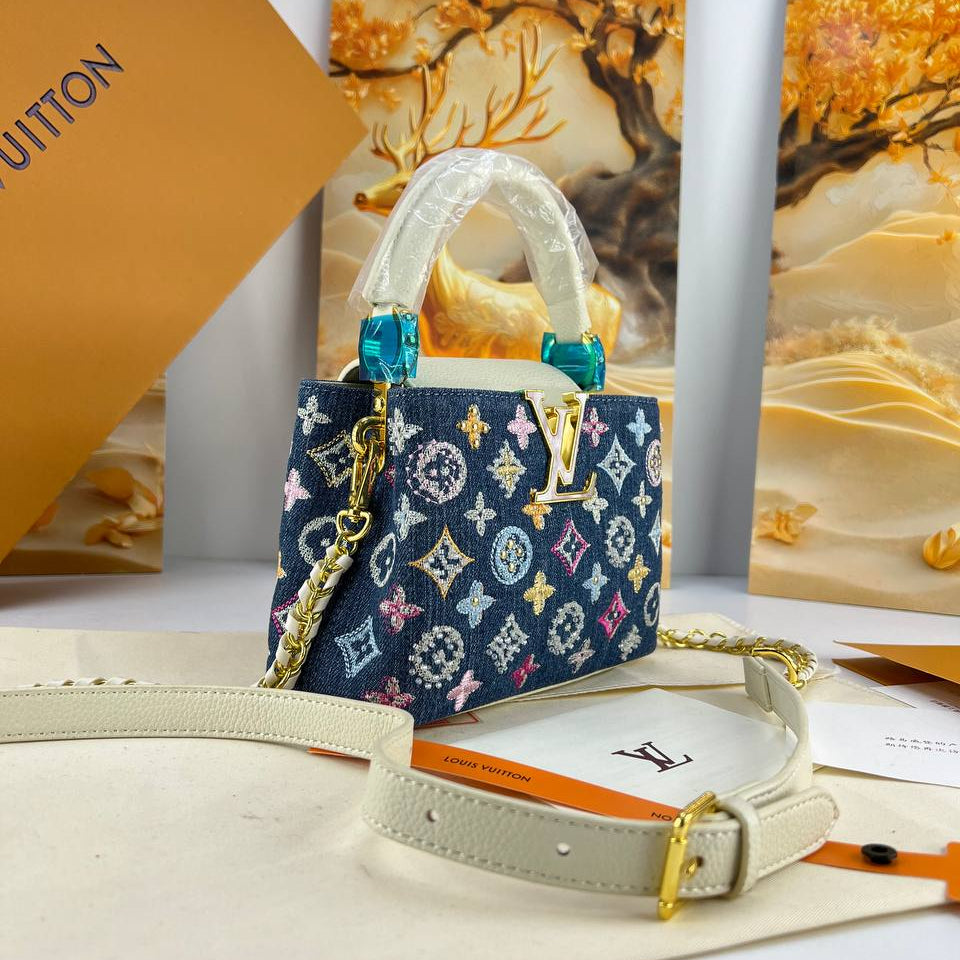 Louis Vuitton Monogram Denim Handbag with Gold Tone Accents