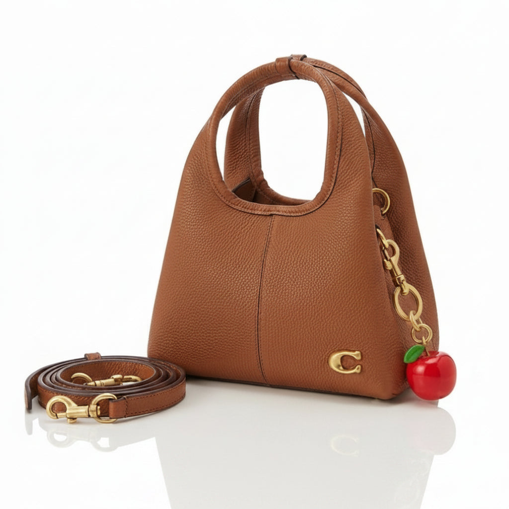 Coach Pebble Grain Leather Handbag with Playful Apple Charm
