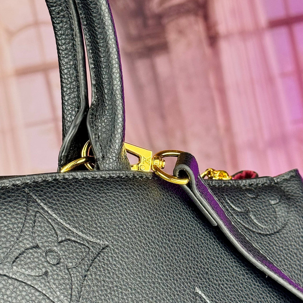 Louis Vuitton Monogram Empreinte Leather Handbag in Black