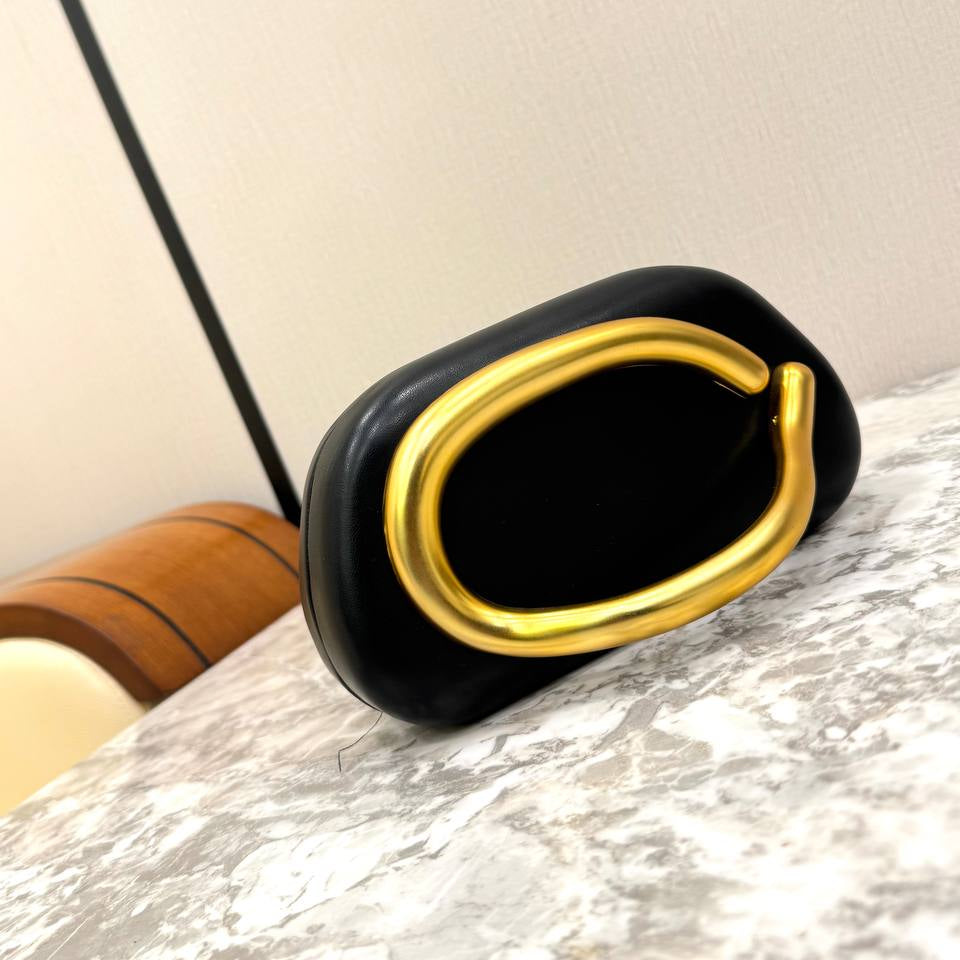 Snakeskin Print Oval Clutch with Sculptural Gold Handle 🐍✨👜