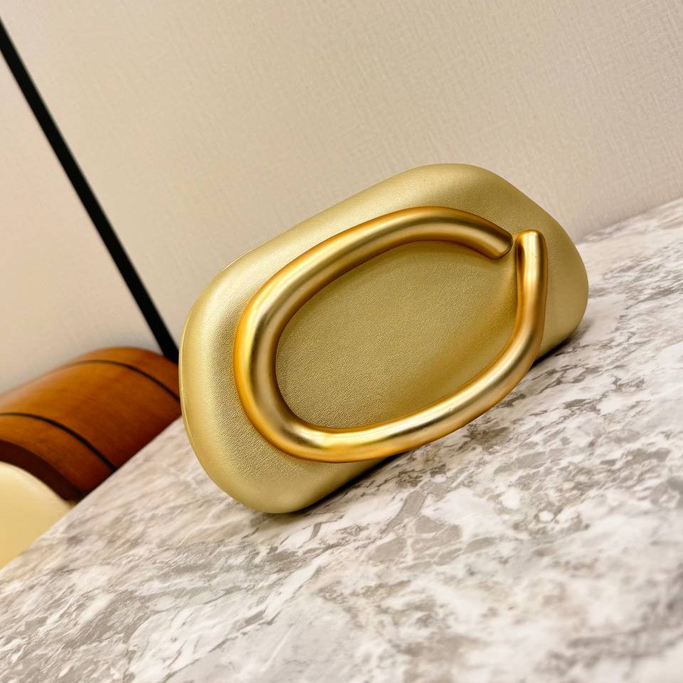 Snakeskin Print Oval Clutch with Sculptural Gold Handle 🐍✨👜