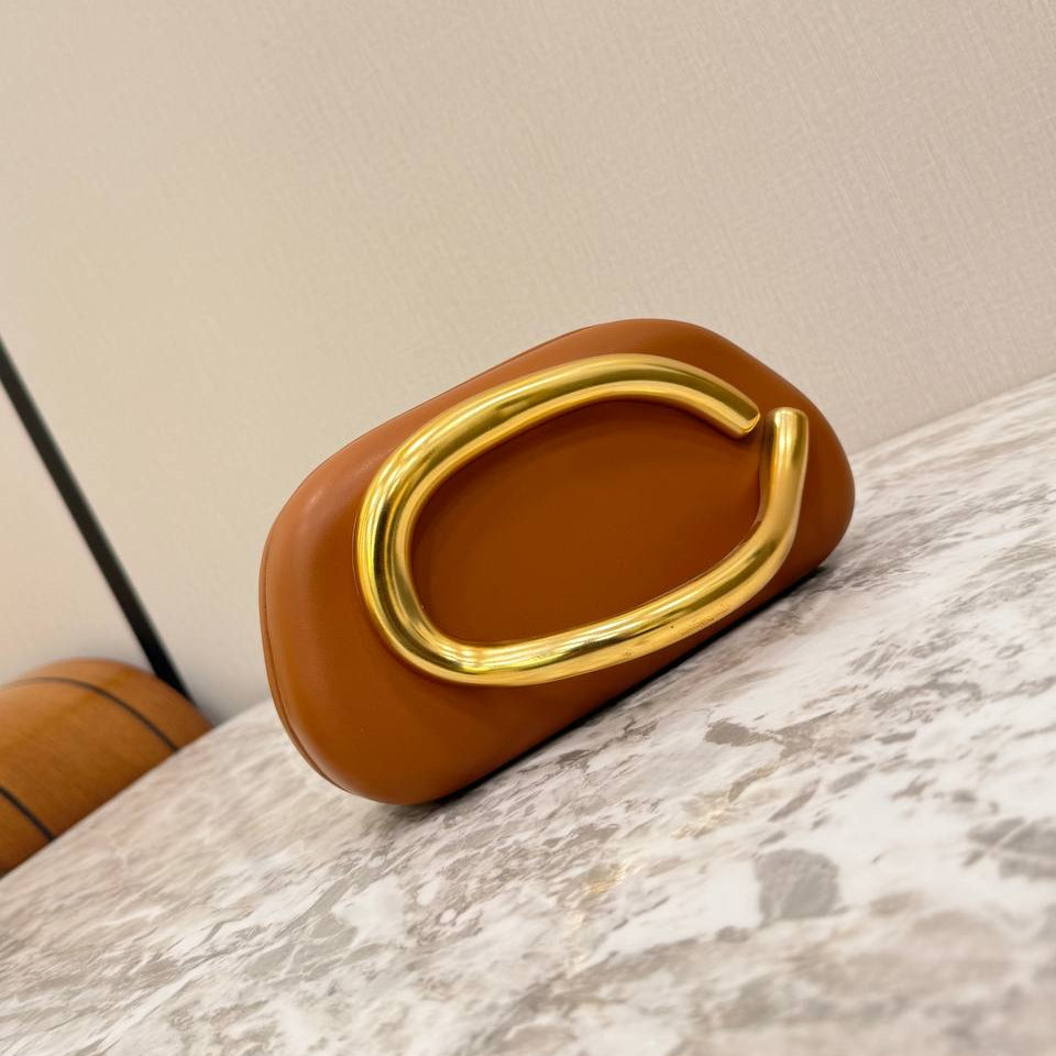 Snakeskin Print Oval Clutch with Sculptural Gold Handle 🐍✨👜