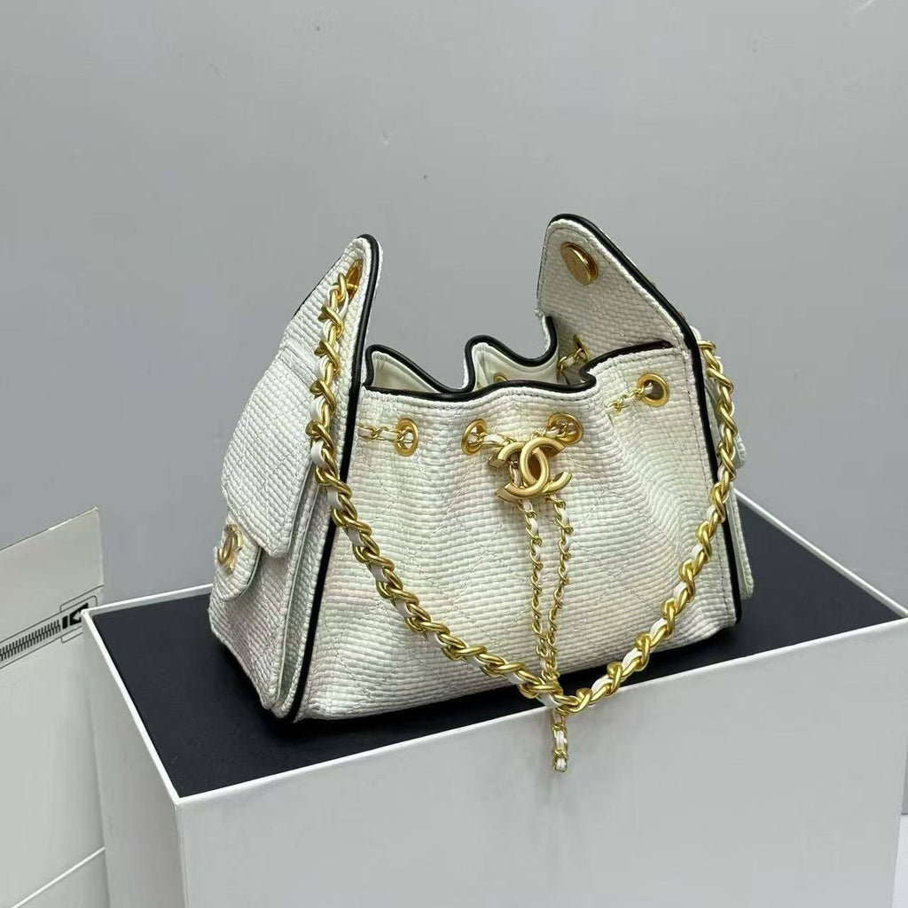 Chanel Woven Straw Bucket Bag with Gold-Tone Chain Details 👜✨